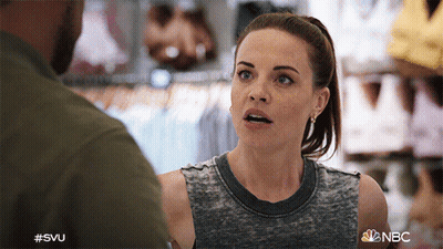 A Woman Is Talking To A Man In A Store With The Hashtag #Svu GIF