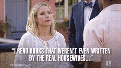 A Woman Is Talking To A Man In A Suit And Bow Tie While A Quote Is Displayed . GIF