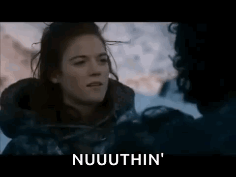 A Woman Is Talking To A Man In The Snow And The Words Nuuuthin Are Visible . GIF
