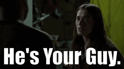 A Woman Is Talking To A Man With The Words He 'S Your Guy GIF