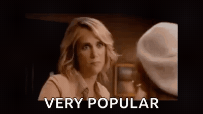 A Woman Is Talking To Another Woman And Making A Funny Face . GIF