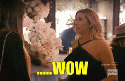 A Woman Is Talking To Another Woman And The Word Wow Is Visible GIF