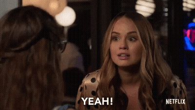 A Woman Is Talking To Another Woman In A Room And Saying Yeah . GIF