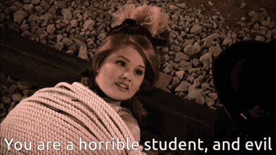 A Woman Is Tied Up With A Rope And The Words " You Are A Horrible Student And Evil " Are Next To Her GIF
