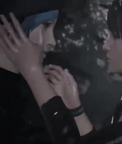 A Woman Is Touching A Man 'S Face With Her Hand . GIF