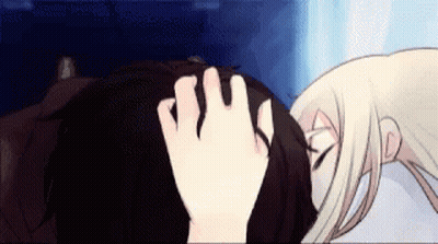 A Woman Is Touching A Man 'S Forehead With Her Hand . GIF