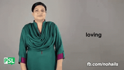A Woman Is Using Sign Language To Say The Word Loving . GIF