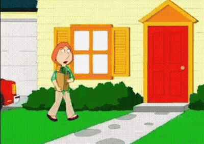 A Woman Is Walking Down A Sidewalk In Front Of A House . GIF