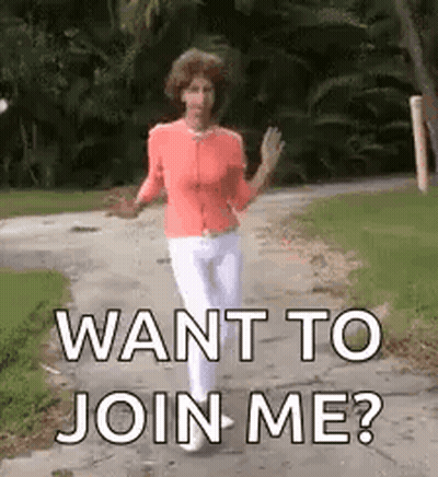 A Woman Is Walking Down A Sidewalk With The Words `` Want To Join Me ? '' Written On It . GIF