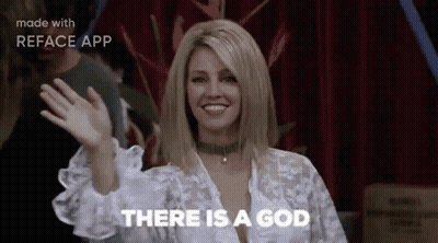 A Woman Is Waving Her Hand And Saying `` There Is A God '' While Standing In Front Of A Red Curtain . GIF