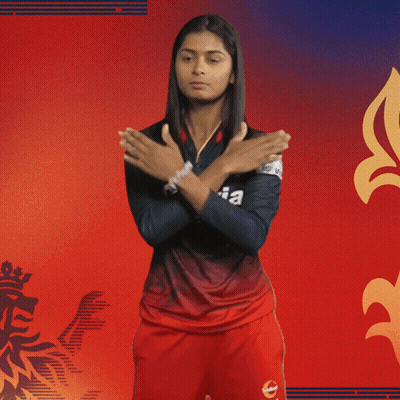 A Woman Is Wearing A Black And Red Kajaria Jersey GIF
