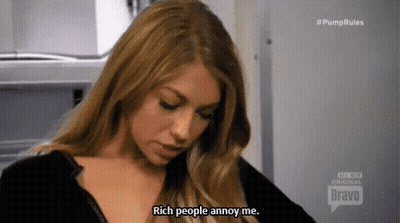 A Woman Is Wearing A Black Shirt And Saying `` Rich People Annoy Me . '' GIF