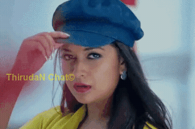 A Woman Is Wearing A Blue Hat And A Yellow Shirt .. GIF
