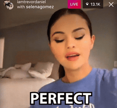 A Woman Is Wearing A Blue Shirt That Says Perfect On It GIF