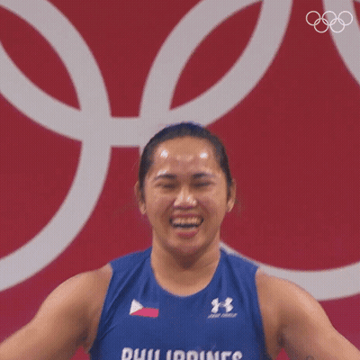A Woman Is Wearing A Blue Tank Top That Says Philippines On It GIF