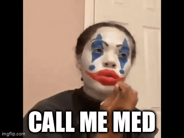 A Woman Is Wearing A Clown Costume And Applying Makeup . GIF