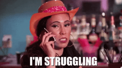 A Woman Is Wearing A Cowboy Hat And Talking On A Cell Phone . GIF