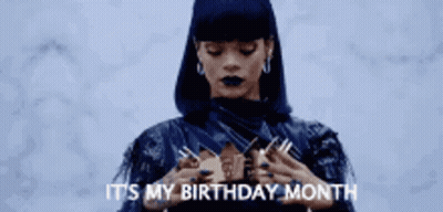 A Woman Is Wearing A Crown On Her Head . GIF