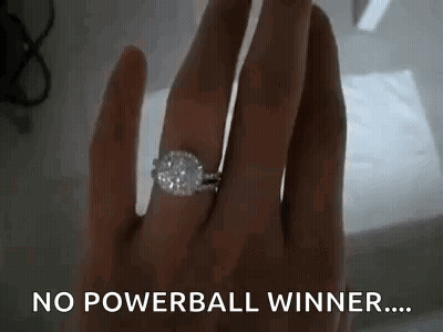 A Woman Is Wearing A Diamond Ring On Her Finger And Says `` No Powerball Winner ... '' GIF