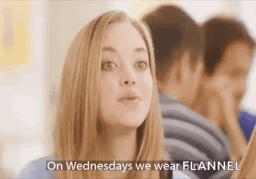 A Woman Is Wearing A Flannel On Wednesdays GIF