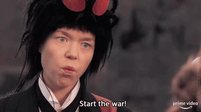 A Woman Is Wearing A Fly Costume And Making A Funny Face . GIF