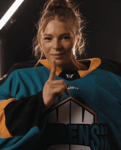 A Woman Is Wearing A Jersey That Says Dens GIF