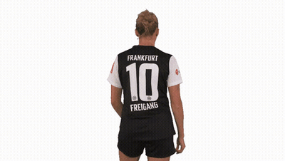 A Woman Is Wearing A Jersey With The Number 10 On The Back GIF