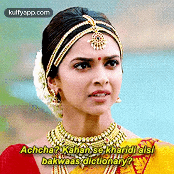 A Woman Is Wearing A Necklace And A Headband And Says Achcha ? GIF