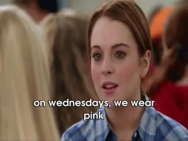 A Woman Is Wearing A Plaid Shirt And Says On Wednesdays We Wear Pink GIF
