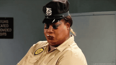A Woman Is Wearing A Police Uniform And A Hat GIF