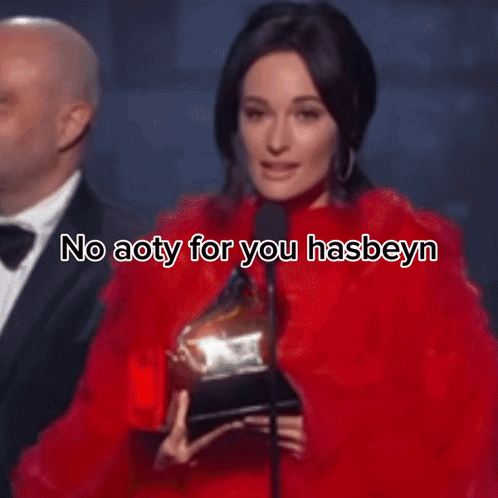 A Woman Is Wearing A Red Dress And A Necklace And Says Help Me Kacey GIF