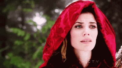 A Woman Is Wearing A Red Hood And Holding A Sword . GIF