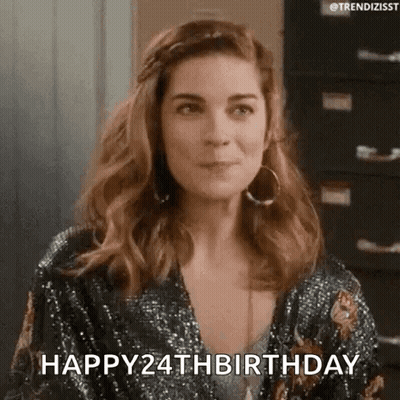A Woman Is Wearing A Sequined Dress And Hoop Earrings And Saying Happy 24Th Birthday . GIF