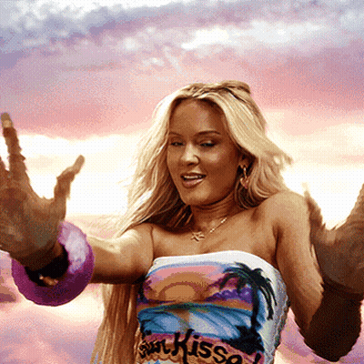A Woman Is Wearing A Shirt That Says Sin Kisso On It GIF