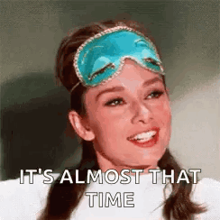 a woman is wearing a sleep mask and smiling .