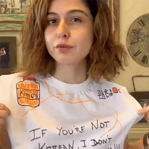 A Woman Is Wearing A T-Shirt That Says " If You 'Re Not Korean I Don 'T " GIF