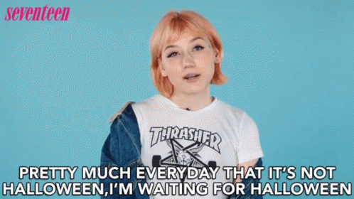 A Woman Is Wearing A Thrasher Shirt And A Denim Jacket GIF