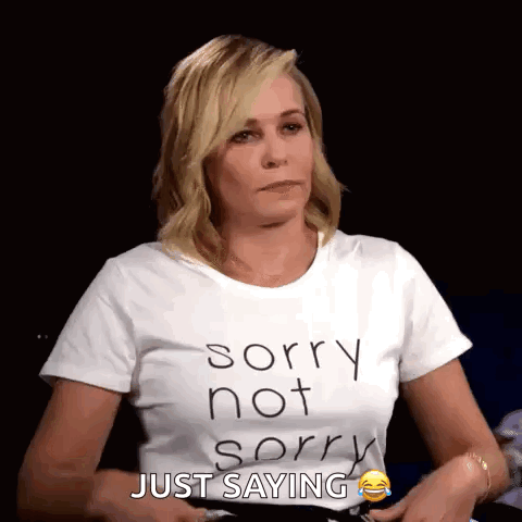 A Woman Is Wearing A White T-Shirt That Says Sorry Not Sorry Just Saying GIF