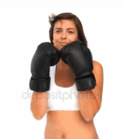 A Woman Is Wearing Boxing Gloves And A White Tank Top GIF