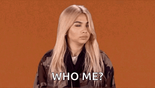 A Woman Is Wearing Headphones And A Camouflage Jacket And Asking Who Me . GIF