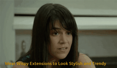 A Woman Is Wearing Wispy Extensions To Look Stylish And Trendy .. GIF