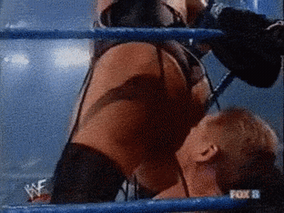 A Woman Is Wrestling A Man In A Ring With A Fox 8 Logo In The Background GIF