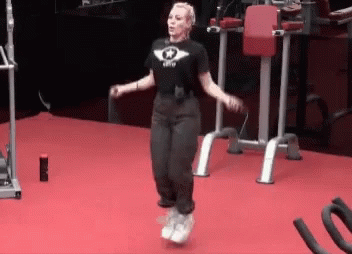 A Woman Jumping A Jump Rope In A Gym GIF