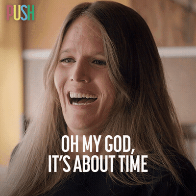 A Woman Laughs With The Words Oh My God It 'S About Time Below Her GIF