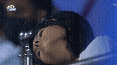A Woman Laying In A Hospital Bed With The Indians Logo Above Her GIF
