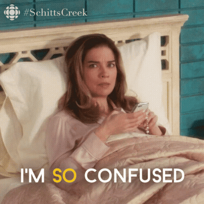 A Woman Laying In Bed With The Words I 'M So Confused In Yellow GIF