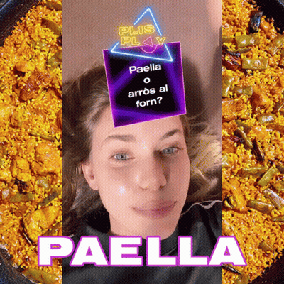 A Woman Laying In Front Of A Plate Of Paella GIF