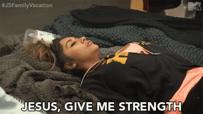 A Woman Laying On A Bed With Jesus Give Me Strength Written On Her Face GIF