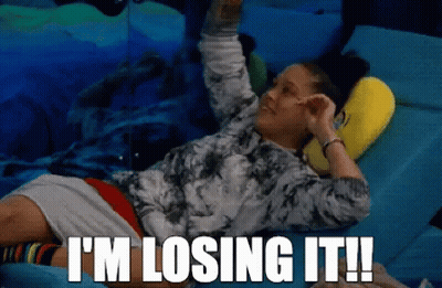 A Woman Laying On A Bed With The Words " I 'M Losing It " Written Above Her GIF