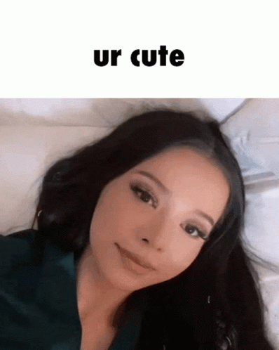 A Woman Laying On A Bed With The Words Ur Cute Written Above Her GIF
